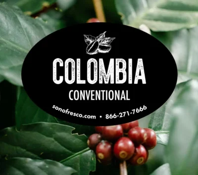 Colombia Conventional coffee label over close-up of ripe red coffee cherries and green leaves
