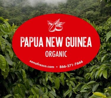 Papua New Guinea Organic coffee label over lush green coffee plants in PNG highlands
