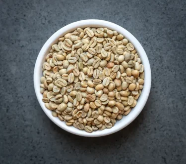 Ethiopia Sidamo Natural FTO green coffee beans in a white bowl