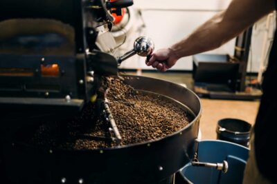 Coffee roaster cooling freshly roasted coffee beans after roasting process