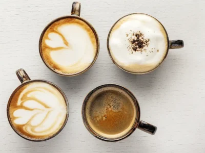 Assortment of espresso, cappuccino, latte, and other coffee drinks displayed together